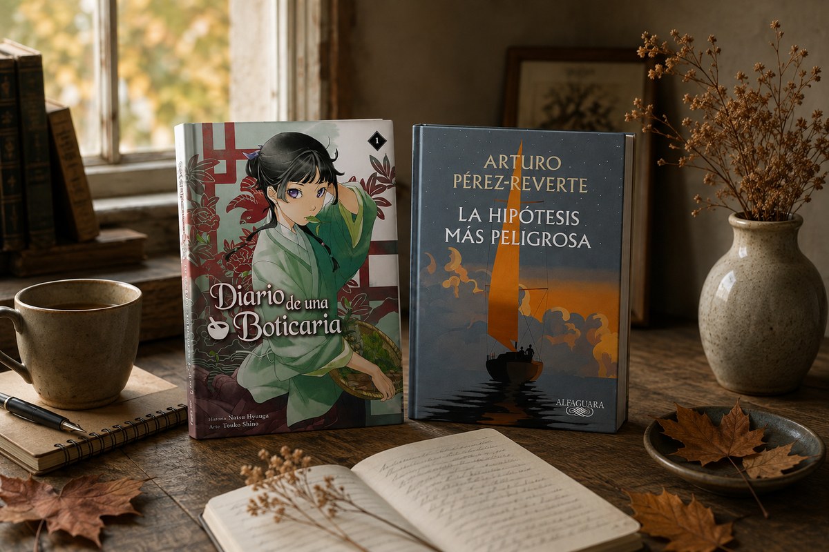 Dos libros ilustrados están colocados de pie sobre una mesa rústica de madera, junto a una taza, un cuaderno, hojas secas y un jarrón cerca de una ventana.